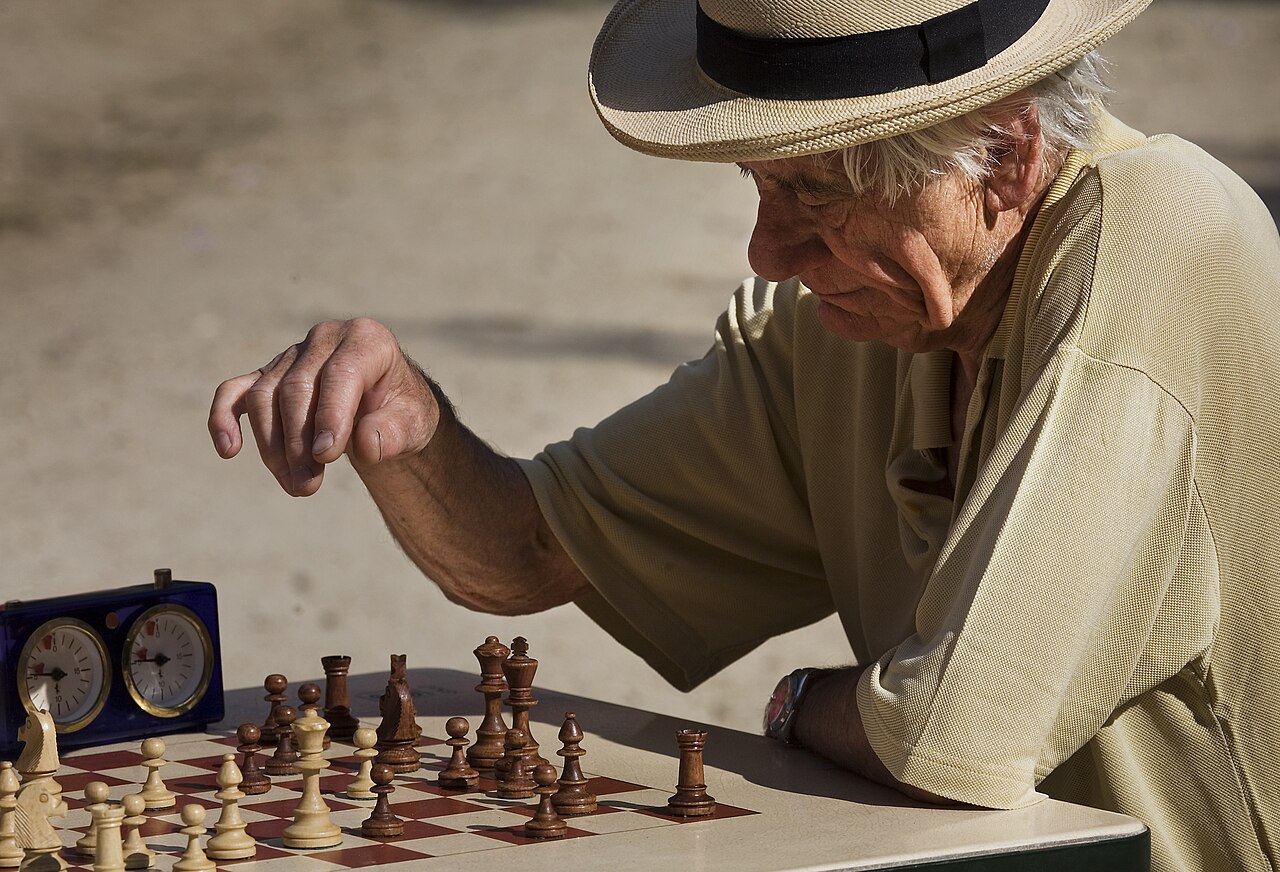 Players at outdoor chess tables in the Jardins du Luxembourg, Paris